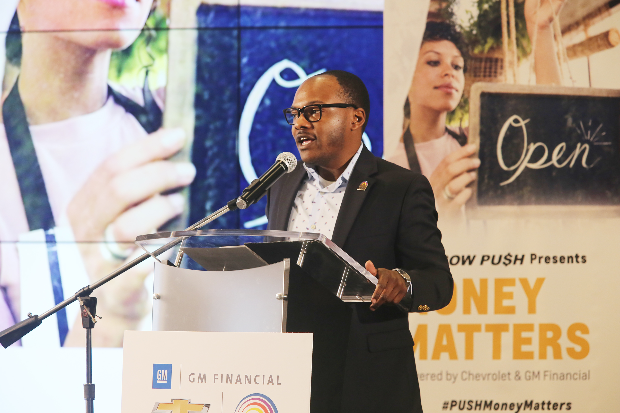 Speaker at podium with PUSH and Chevrolet branding